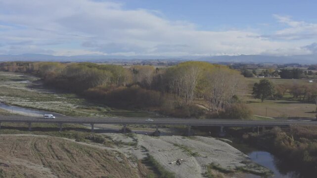 A white camper can driving across a bridge in New Zealands South Island, East Coast