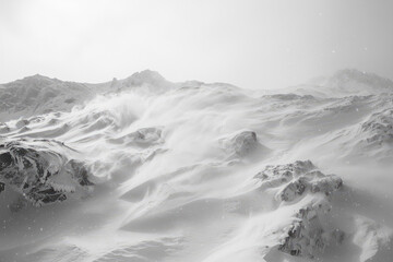 A ferocious blizzard engulfs the untouched landscape, swirling snow and howling winds create a mesmerizing winter spectacle.