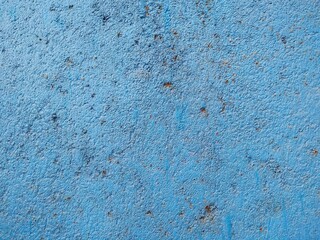 Bright blue color wall with an old grunge textured for background usage