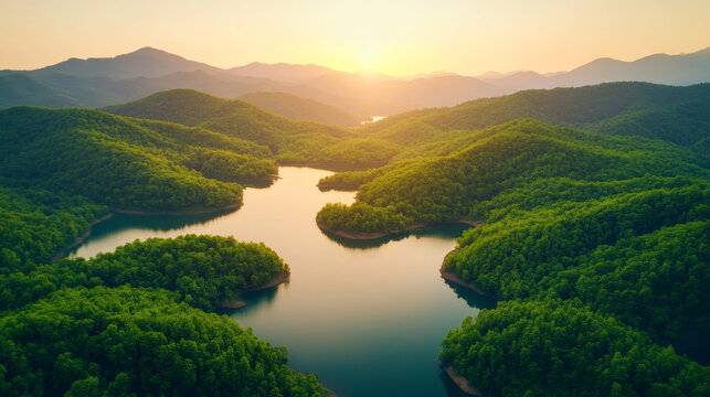 "A beautiful landscape of green mountains and a lake in the morning with a sunrise sky. This nature scene showcases a watershed forest, highlighting water and forest sustainability. The aerial view re