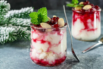 Risalamande is a traditional Danish Christmas dessert, cold rice pudding with whipped cream and almonds. Served with hot cherry sauce.