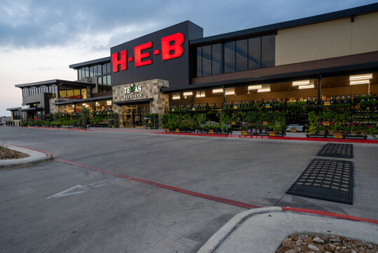 HEB grocery store entrance with sign illuminated, Texas Backyard Gardening, Pharmacy, new design for 2024, center, Boerne, Texas