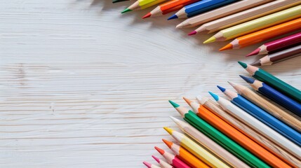 Obraz premium colorful pencils on white wooden background empty table mockup