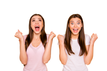 Unexpected luck! Portrait lucky cheerful positive millennial girls trip beautiful feel satisfied scream shout yeah raise fists impressed long hair light t-shirts isolated yellow background
