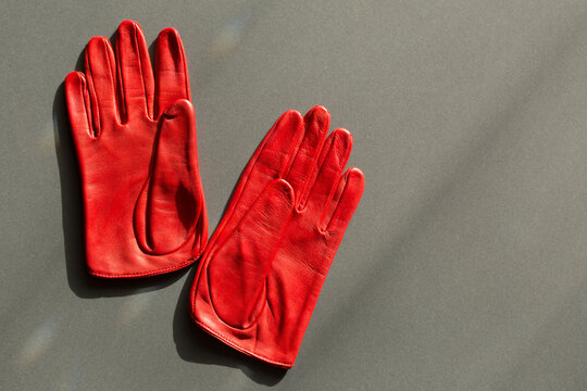 Classic women's gloves made of natural leather, red color