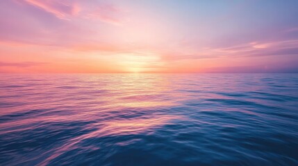 Fototapeta premium Stunning view of a calm ocean with a colorful sunset reflecting on the water