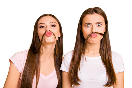 Close up photo two people beautiful she her ladies models send air kisses playing curls make fake moustache crazy facial expression wear white pink casual t-shirts isolated yellow background