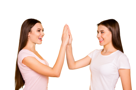 Portrait of nice-looking cute charming lovely attractive cheerful cheery optimistic positive straight-haired ladies giving high five isolated over bright vivid shine background