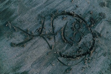 kids funny drawing at black sand beach Tabanan Bali