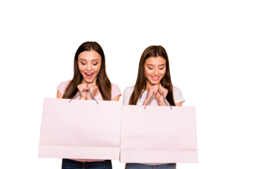 Portrait of nice cute charming lovely winsome sweet tender attractive cheerful cheery straight-haired girls holding in hands new cool purchase isolated on bright vivid shine yellow background