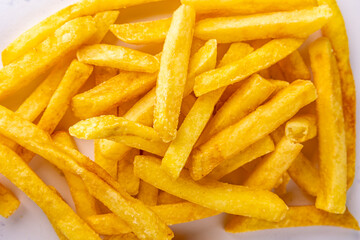 Crispy French Fries Close-Up - A mesmerizing close-up of crispy, golden French fries, highlighting each fry's perfect texture