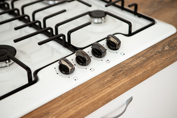 kitchen stove with burners and regulating valve
