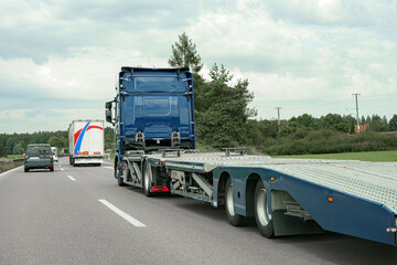 A truck for transporting passenger cars on the highway.