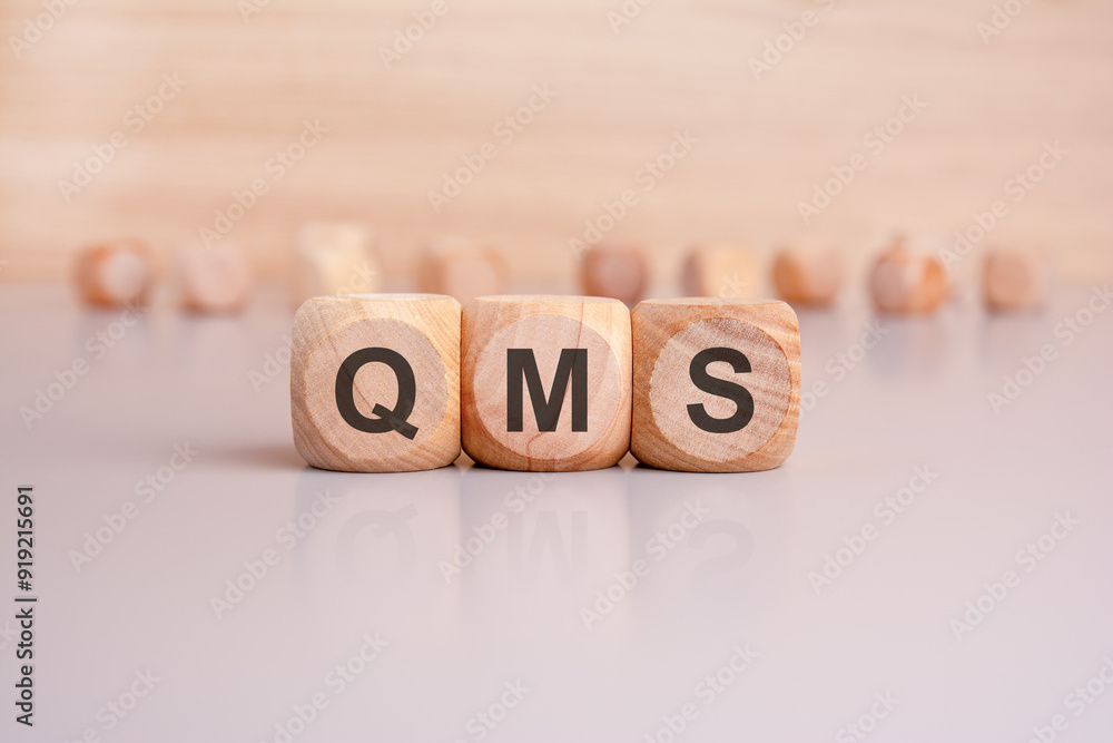 Aufkleber qms an in depth concept overview of a quality management system utilizing wooden blocks