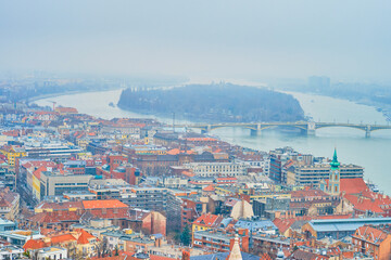 The misty cityscape with Margaret Bridge on background, Budapest, Hungary