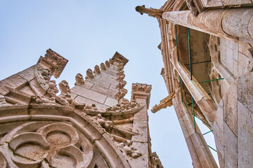 The scenic carved decorations on the top of bell tower of Matthias Church in Budapest, Hungary