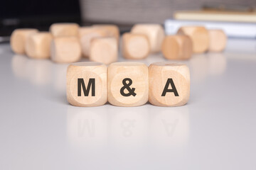 wooden blocks that represent the comprehensive MA strategy in the business landscape