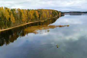 View of a kayak on an autumn lake.