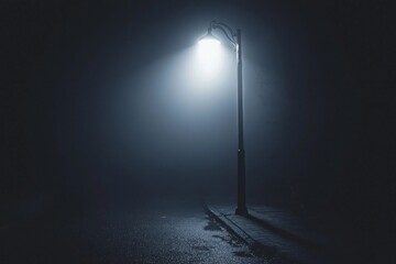 A bright white street lamp casting a pool of light in a dark, foggy alley. 