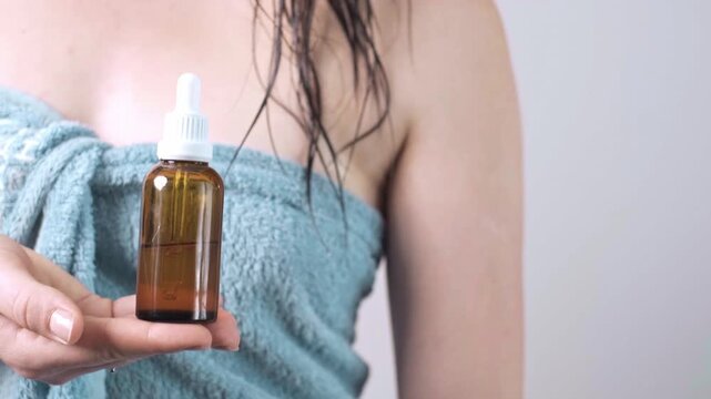 Scalp massage brush and oil bottle, Enhances scalp health by removing dead skin cells and preventing dryness and itchiness.