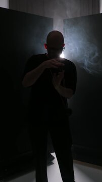 guy professionally spins yo yo, rope tricks, great background, light through fog