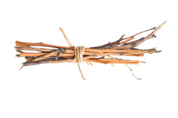 Fototapeta na wymiar Dry branches, twigs isPine needles. Fallen dry twigs on ground. Forest floor spring season change. Dry pine needles are a fire hazard. Dried brittle needles areolated on white background, 