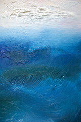 Decorative original painting textured background. Fine art illustration with space for text. Nobody closeup seascape with vague skyline. Turquoise blue brush strokes waves.