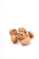 Pistachios nuts over white background. Healthy food concept.