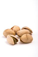 Pistachios nuts over white background. Healthy food concept.