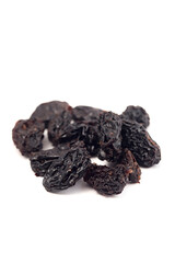 Black raisins on a white background. Dried fruits.
