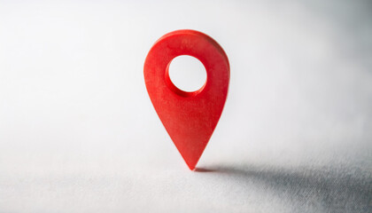 Red location marker isolated on white background. Navigational search. Close-up.