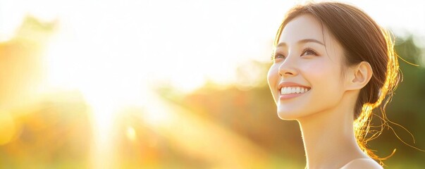 Fototapeta premium A beautiful Asian woman with clean skin, standing under soft sunlight with a relaxed expression