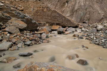 Melt waters of the Becho Glacier. Water flowing from the glacier on Ushba mountain. 
Dolra River in Becho Valley with panoramic views of Ushba Mountain. River photos taken with long exposure.