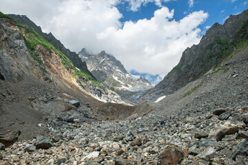 Melt waters of the Becho Glacier. Water flowing from the glacier on Ushba mountain. 
Dolra River in Becho Valley with panoramic views of Ushba Mountain. River photos taken with long exposure.