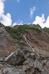Melt waters of the Becho Glacier. Water flowing from the glacier on Ushba mountain. 
Dolra River in Becho Valley with panoramic views of Ushba Mountain. River photos taken with long exposure.