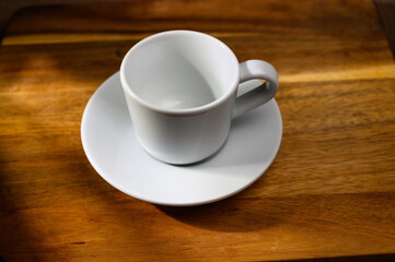 view of a coffee cup on a wooden table with a beautiful wood