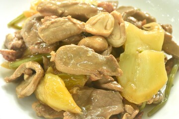 fried slice peking duck with pickled cabbge and straw mushroom on plate