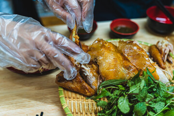 Roasted chicken with honey, Asia food. Served with vegetables and sticky rice. Selective focus