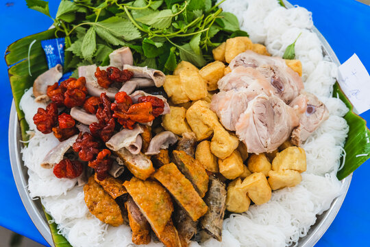 A delicious Vietnamese dish, Bun Dau Mam Tom, is a popular street food made from rice noodles with boiled meat, fried tofu, shrimp paste and green vegetables, cucumber and spices such as chili, lime