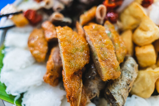 A delicious Vietnamese dish, Bun Dau Mam Tom, is a popular street food made from rice noodles with boiled meat, fried tofu, shrimp paste and green vegetables, cucumber and spices such as chili, lime