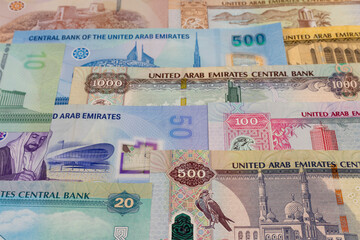United Arab Emirates banknotes background. Selective focus.