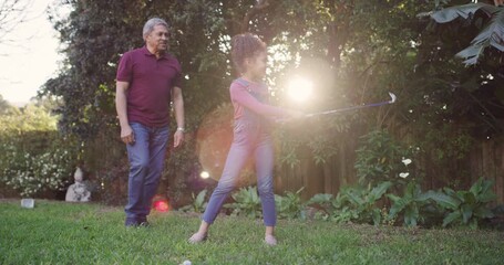 Family, grandfather and playing golf for a fun activity with a cheerful little girl celebrating and giving her grandpa a high five. Mature man clapping for his grandchild for motivation and support