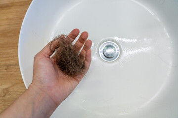 extrem hair loss with sink background