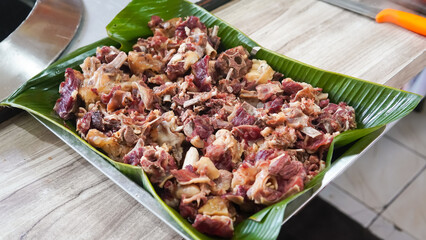 Chopped onions and pieces of meat are fried in boiling oil. Cooking pilaf in a cauldron, a step-by-step recipe for real pilaf.