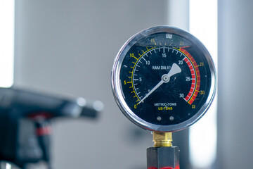 close-up in a car service, a pressure measurement sensor in a car on a gray background indicators...