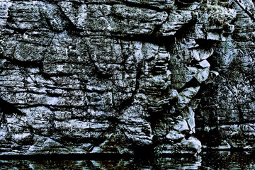 Stone gray black crumbling old rock formation nature background