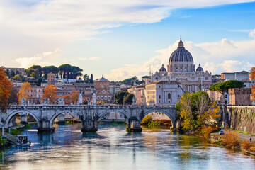 Beautiful autumn image of St. Peter's Basilica, Ponte Sant Angelo and Tiber River at dusk in Rome,...