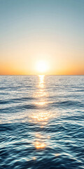 Obraz premium Bright sun rising over a calm ocean evoking hope
