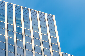 fragments office and residential buildings in European city with reflective glass facades, modern high-rise office buildings and residential towers