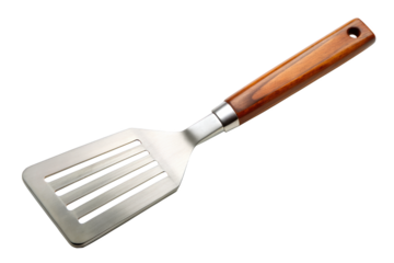 Spatula with a wood handle and stainless steel slotted head, combining traditional craftsmanship with modern functionality. Ideal for cooking and grilling. Isolated on transparent background, png.